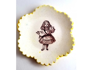 Tiny Plate Alice in Wonderland holding a pig!